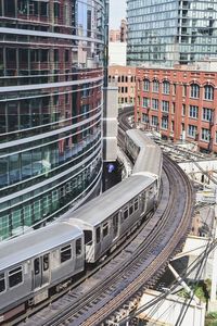 High angle view of railroad tracks amidst buildings in city