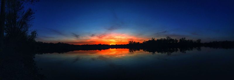 Reflection of trees in calm lake