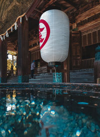 Reflection of building on wet swimming pool