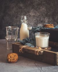 Glass of wine and glasses on table