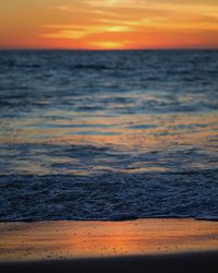 Scenic view of sea against sky at sunset