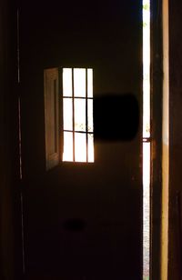 Close-up of window in dark room