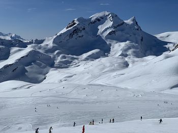 Scenic view of snowcapped mountains against sky