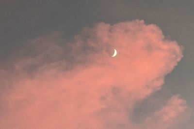 Low angle view of moon against sky at sunset