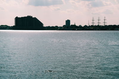 Sea with buildings in background