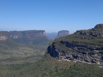 Scenic view of mountain range against clear blue sky