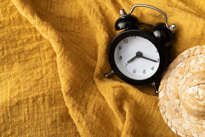 High angle view of clock on table