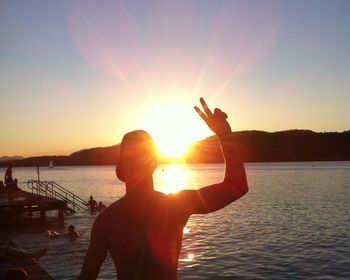 Man at beach during sunset