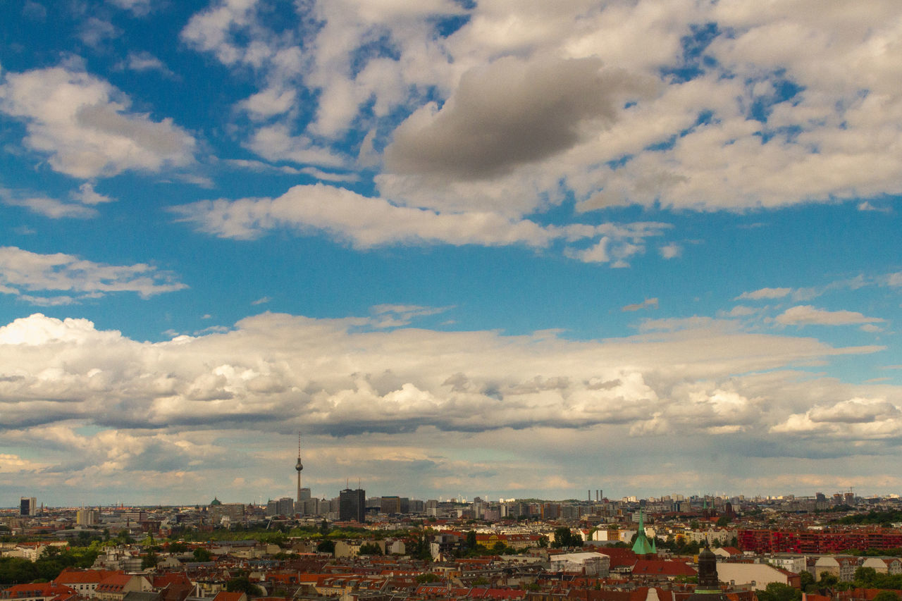 HIGH ANGLE SHOT OF BUILDINGS AGAINST SKY