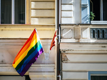 Multi colored flags hanging on building