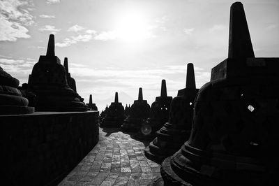 Stupas at borobudur temple against sky