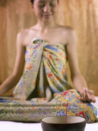 Young woman meditating in spa