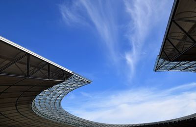 Low angle view of building against cloudy sky