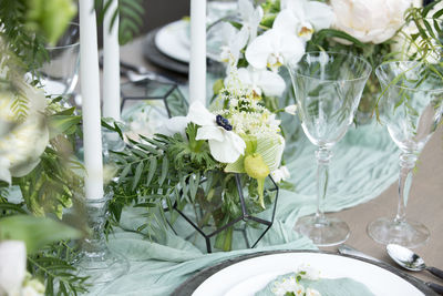 Close-up of white roses in vase on table