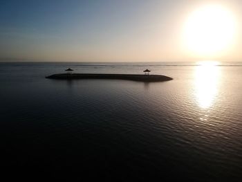 Scenic view of sea against clear sky during sunset