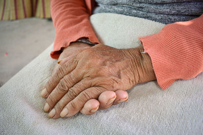 Midsection of man with hands