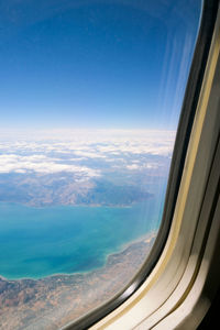 Aerial view of clouds seen from airplane window