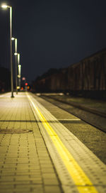 Close-up of railroad tracks at night