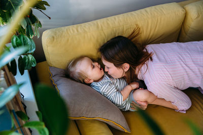 High angle view of mother and daughter at home