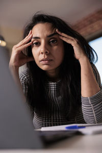 Portrait of young woman looking away