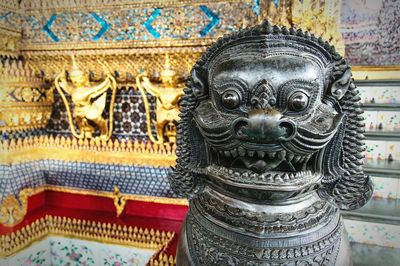 Close-up of statue against temple