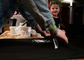 Portrait of cute boy with ice cream in plate on table