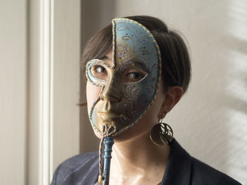 Portrait of woman with mask