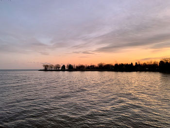 Scenic view of sea against sky at sunset