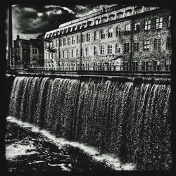 Scenic view of waterfall in city
