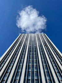 Low angle view of modern building against blue sky