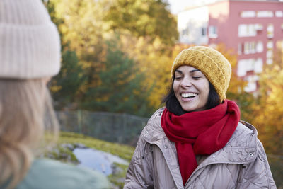 Happy woman in autumn scenery