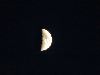 Low angle view of moon in the dark