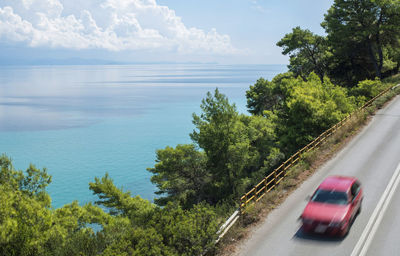 Road by sea against sky