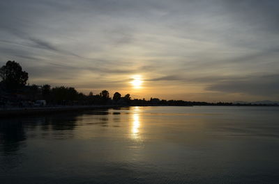 Scenic view of calm lake at sunset