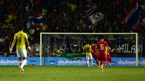 People playing soccer on field