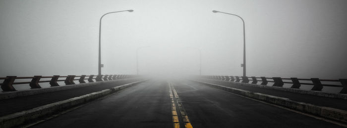 Empty road against clear sky