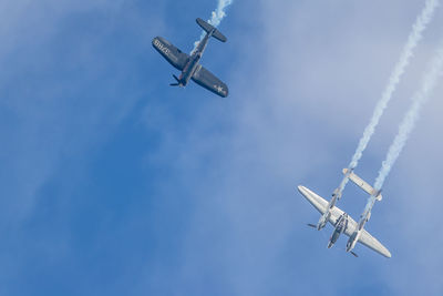 Low angle view of airplane flying in sky