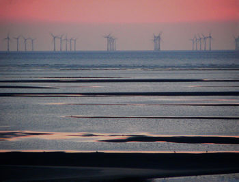 Scenic view of sea against sky at sunset