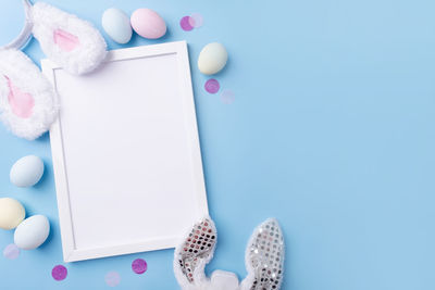 Directly above shot of easter eggs on blue background