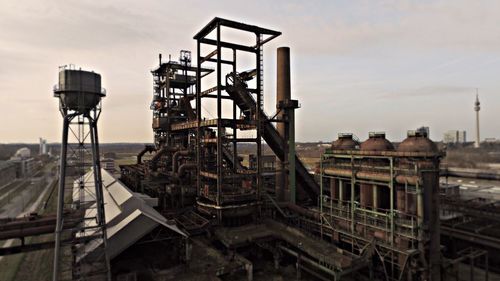 Old factory against sky