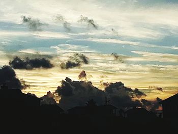 Scenic view of townscape against sky during sunset