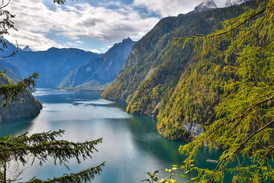 Scenic view of lake and mountains against sky