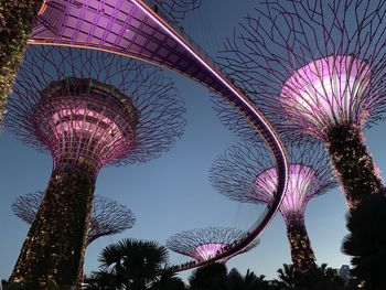 Low angle view of illuminated ferris wheel against sky