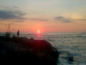 Scenic view of sea at sunset