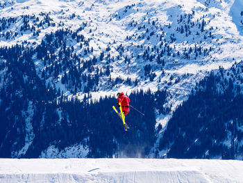 Man skiing on snowcapped mountain