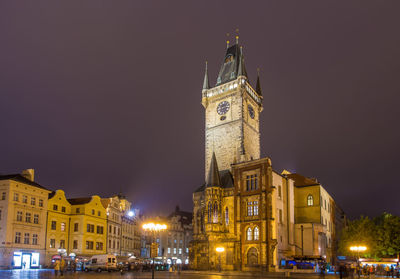 Clock tower in city at night