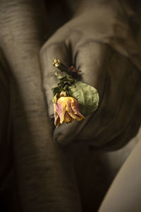 Close-up of hand holding flower bouquet