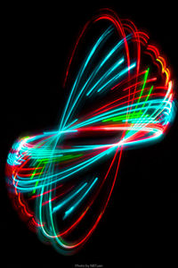 Light trails against black background