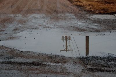Reflection of puddle in water