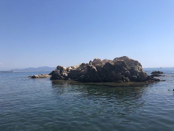 Scenic view of sea against clear sky
